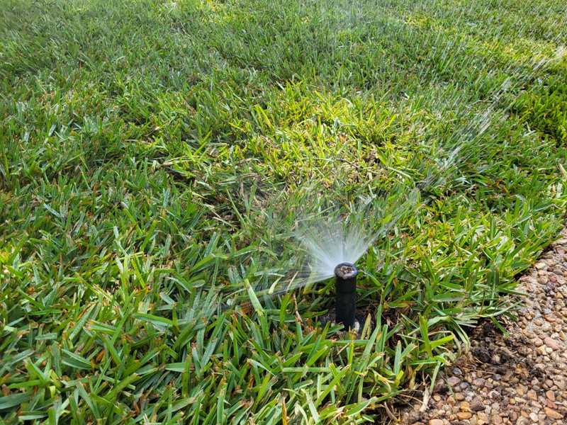 Misaligned sprinkler head wasting water