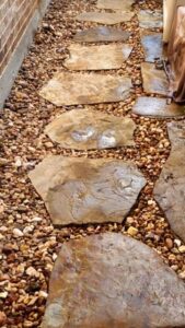 Landscape gravel installed for flagstone pathway